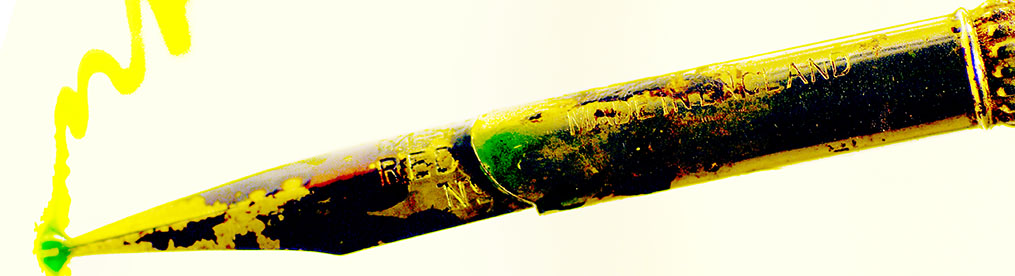 A dip pen drawing a line of bright yellow/green on white paper